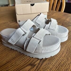 Ugg Women’s Goldenstar Hi Slide in Sand